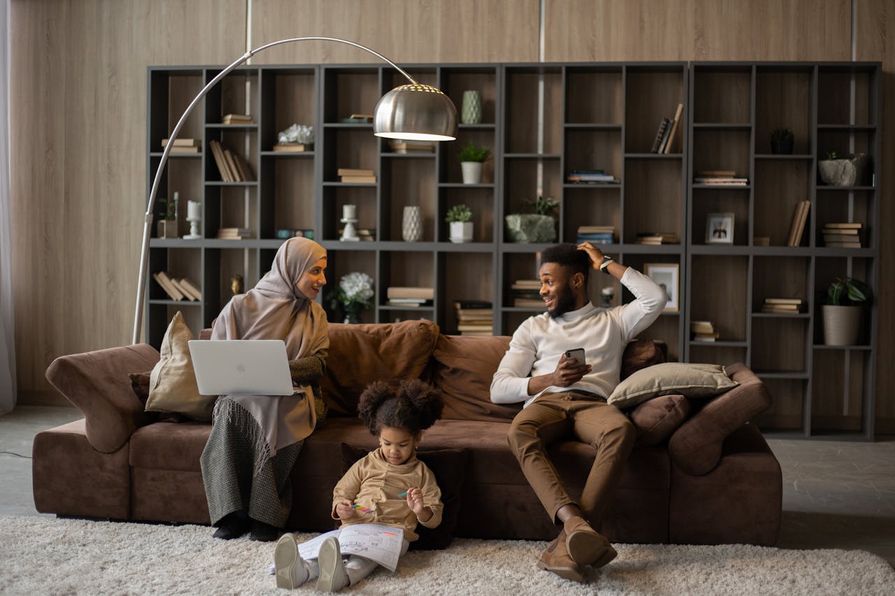 Couple with child looking at websites.